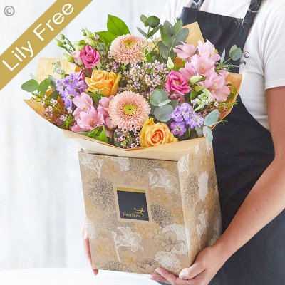 Lily Free Florists Choice Hand tied bouquet made with seasonal flowers Code: LFHT2 | National Delivery and Local Delivery Or Collect From Shop