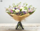Lily Free Florists Choice Hand tied bouquet made with seasonal flowers Code: LFHT4 | National / local delivery or collect from shop