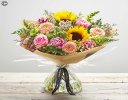 Lily Free Florists Choice Hand tied bouquet made with seasonal flowers Code: LFHT6S | National Delivery and Local Delivery Or Collect From Shop
