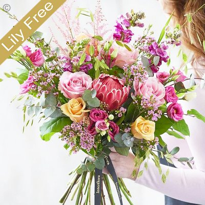 Lily Free Florists Choice Hand tied bouquet made with seasonal flowers Code: LFHT8S | National Delivery and Local Delivery Or Collect From Shop