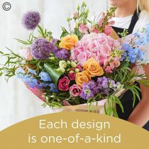 Lily Free Florists Choice Hand tied bouquet made with seasonal flowers Code: LFHT9S | National Delivery and Local Delivery Or Collect From Shop