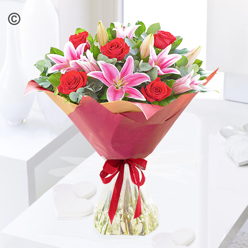 Crimson red rose and pink lily handtied Code: JGF30006CRLB | Local delivery or collect from shop only