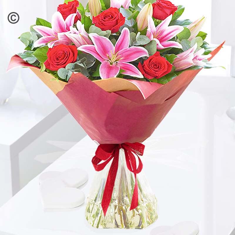 Crimson red rose and pink lily handtied Code: JGF30006CRLB | Local delivery or collect from shop only