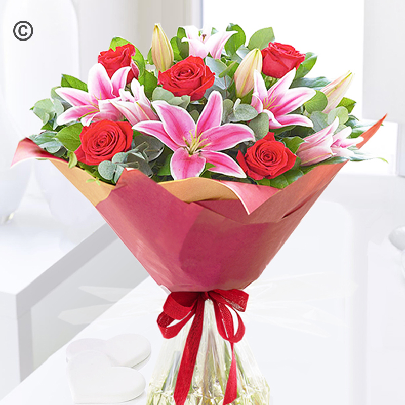 Crimson red rose and pink lily handtied Code: JGF30006CRLB | Local delivery or collect from shop only