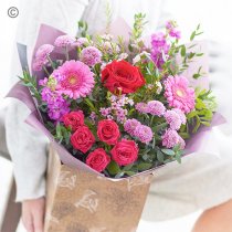 Mixed pink and red hand-tied with one red rose Code: JGFVRFHT2R | Local delivery or collect from our shop only